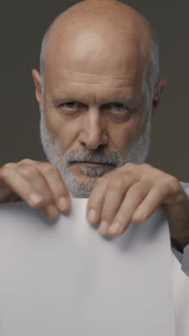 Businessman tearing a contract in pieces