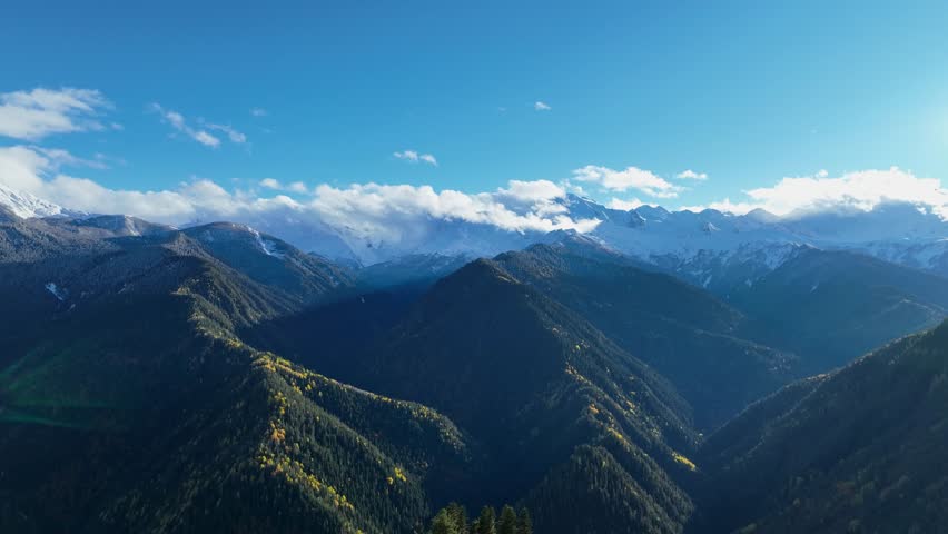 Breathtaking view of a mountain in Autumn scene with snow at Mestia Georgia, autumn forest