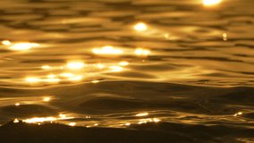 Water Sunset Reflections Golden - Closeup of water surface with shimmering light reflections during sunset. - Powered by Shutterstock - Get 15% off with code: PIKWIZARD15