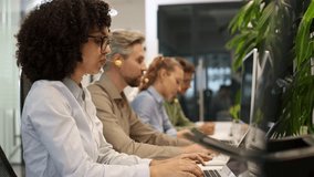 Diverse call center operators working with laptops and headsets, providing customer support - Powered by Shutterstock - Get 15% off with code: PIKWIZARD15