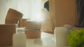 Sustainable businesses are implementing eco-friendly packaging for their products, with proactive delivery workers cleverly packing fresh food into biodegradable paper containers for single use
 - Powered by Shutterstock - Get 15% off with code: PIKWIZARD15