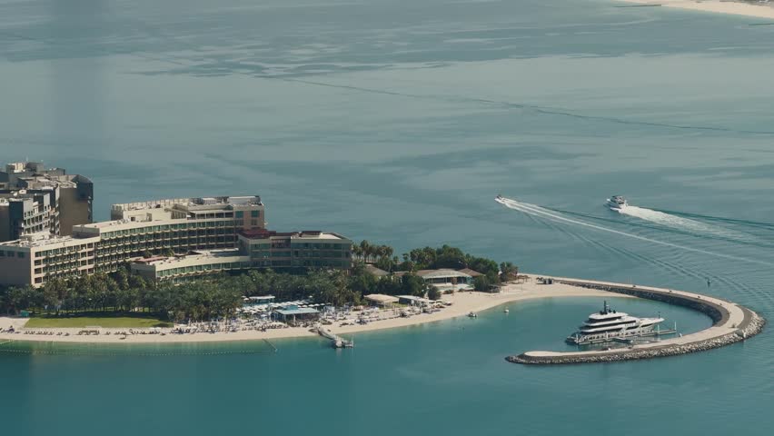 The Palm Jumeirah in Dubai is an artificial island in the shape of a palm tree, famous for its luxury resorts, villas and apartments. It is one of modern wonders, a symbol of engineering and opulence.