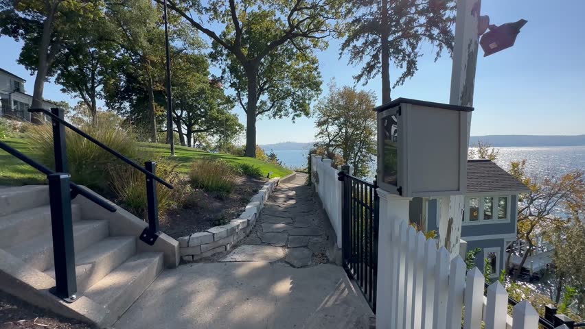 Around Lake Geneva, path winds wide, mansions and gardens on every side