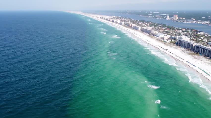 Aerial view of turquoise blue water of Emerald Coast Florida along the coast of gulf of mexico. waterfront hotel Buildings resorts, Waterfront beach Resort Rentals in Fort walton beach