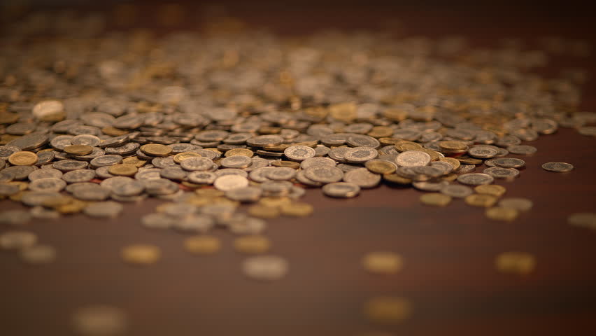 A Detailed CloseUp View of a Pile of Various Coins of Different Denominations and Types