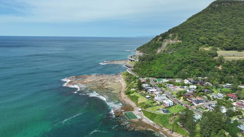 Aerial view of Coalcliff township and coastline near Sea Cliff Bridge on the Pacific Ocean