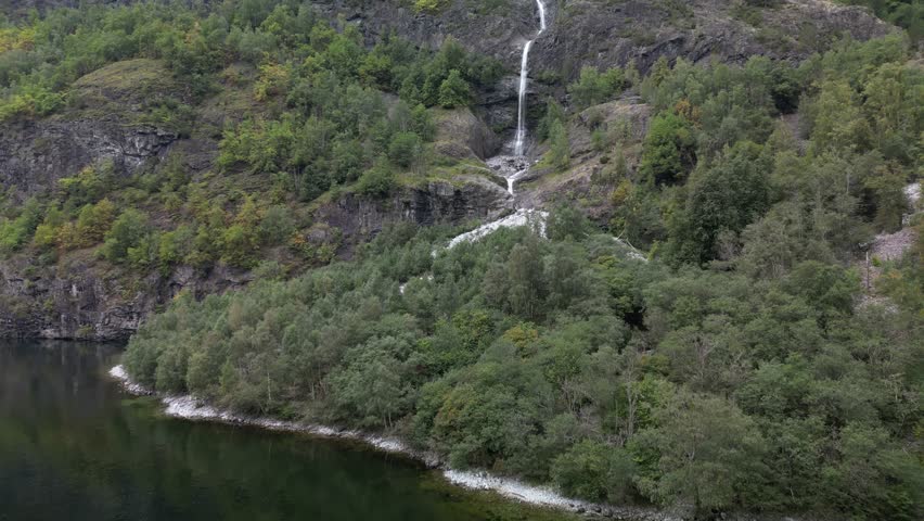 Approaching a vast waterfall in the Norwegian fjords