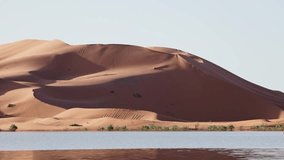 Big dune with flooded lake in morocco - Powered by Shutterstock - Get 15% off with code: PIKWIZARD15