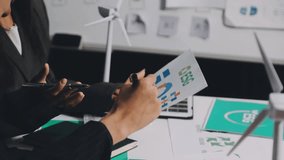 Closeup group Asia businesspeople talk ESG strategies risk management workshop, SDGs report, global warming, green finance investment eco friendly and net zero waste in boardroom training building. - Powered by Shutterstock - Get 15% off with code: PIKWIZARD15