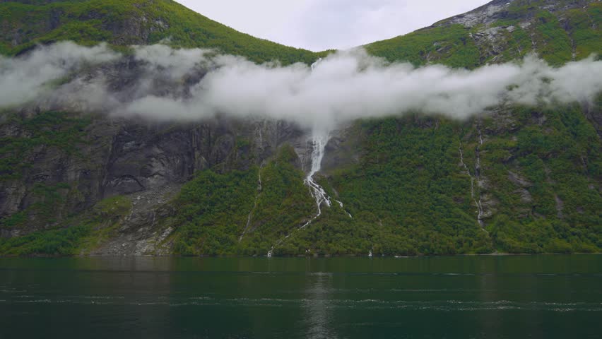 Geiranger Fjord, Norway. Epic scenic Scandinavia nature with waterfall and sea landscape.