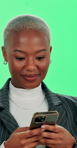 Happy, black woman and phone with good news or green screen for winning on a studio background. Excited, portrait and African female person with smile on mobile smartphone for success or promotion
