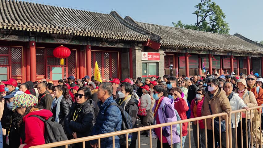 Beijing, China - October 20th, 2024: Tourists queuing at entrance gate to visit Summer Palace.