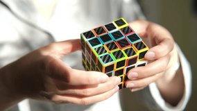 Human mind and hands are solving alternative Rubik's cube - Powered by Shutterstock - Get 15% off with code: PIKWIZARD15