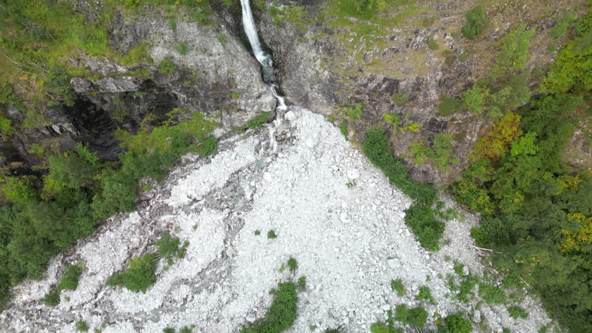 Done shot panning up a giant waterfall in the narrow Norwegian fjords