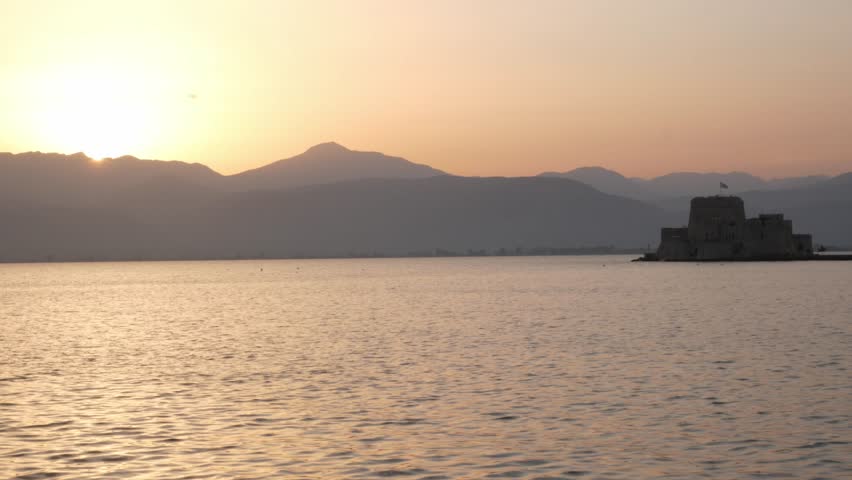 The Bourtzi fortress and island, in Nafplio, Greece, at sunset
