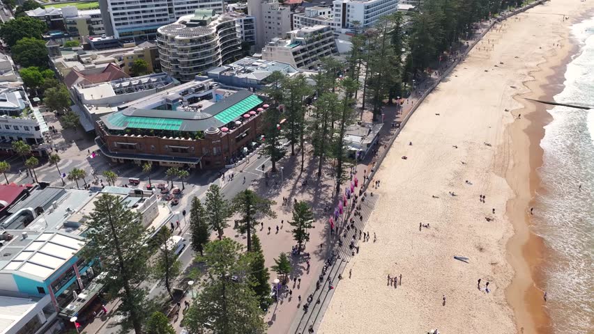 People At The Coastal Walkway At Manly Beach Suburbs In Sydney, New South Wales, Australia. Aerial Drone Shot