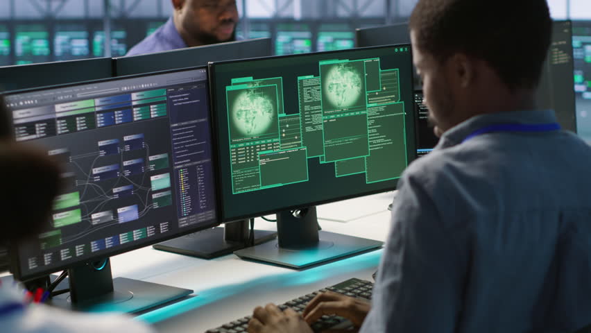 Cybersecurity team monitoring security incidents, alerted by security breach alert, working together to get rid of virus, protecting infrastructure from threats, camera A