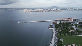 Aerial of George Town Penang island Malaysia port fast ferry connection to Butterworth Malay peninsula drone - Powered by Shutterstock - Get 15% off with code: PIKWIZARD15