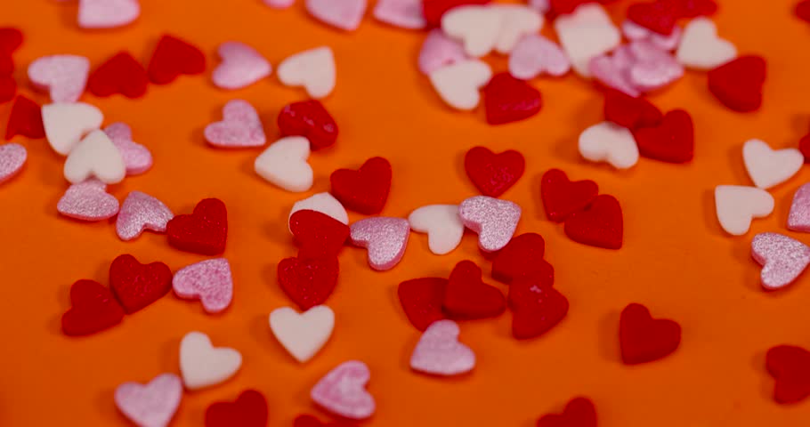 sweet sugar candies in the shape of hearts, red white and pink sugar candies for decoration