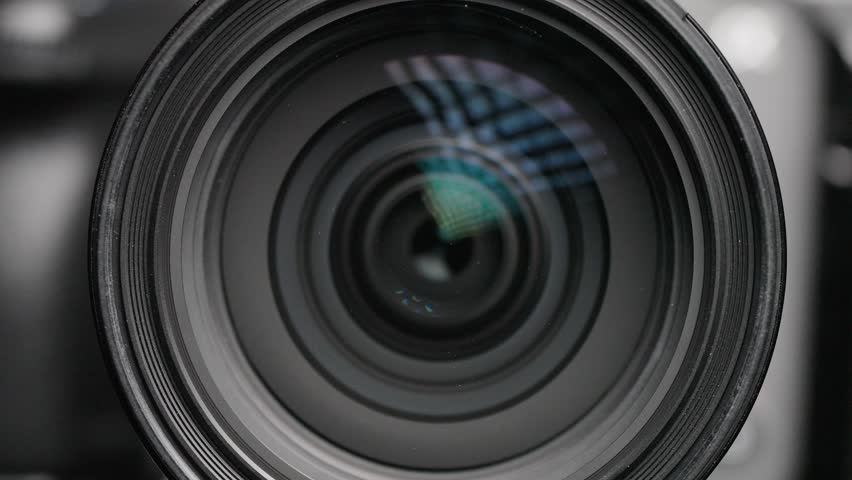 Macro shot capturing the lens elements shifting within the Sony FX3, emphasizing the camera's advanced optical design