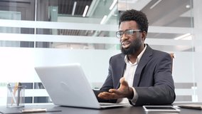 Upset african american businessman in formal suit receiving bad news on laptop while sitting at desk at a workplace in a business office. Concerned black man reads an unpleasant message on a computer - Powered by Shutterstock - Get 15% off with code: PIKWIZARD15