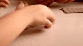 4k video, close-up of grandfather and grandson's hands playing cards, teaching a child to play cards, spending time together. - Powered by Shutterstock - Get 15% off with code: PIKWIZARD15