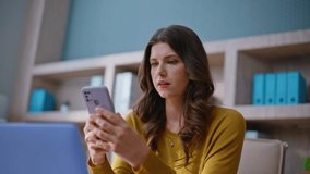 Working lady checking cellphone feeling stress at home workplace closeup. Upset entrepreneur reading phone message worried business failure. Frustrated business woman receiving cooperation decline. - Powered by Shutterstock - Get 15% off with code: PIKWIZARD15