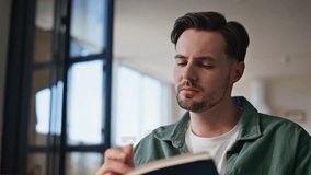 Man hand writing copybook at home closeup. Focused guy noting information in notebook using pen indoors. Inspired pensive male writer journalist noticing ideas thoughts at diary in light apartment  - Powered by Shutterstock - Get 15% off with code: PIKWIZARD15