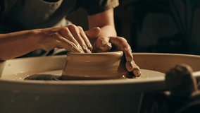 Woman potter works with clay on master class in studio. Working process in ceramic workshop. Potter making vase on pottery wheel. Handmade concept.  - Powered by Shutterstock - Get 15% off with code: PIKWIZARD15