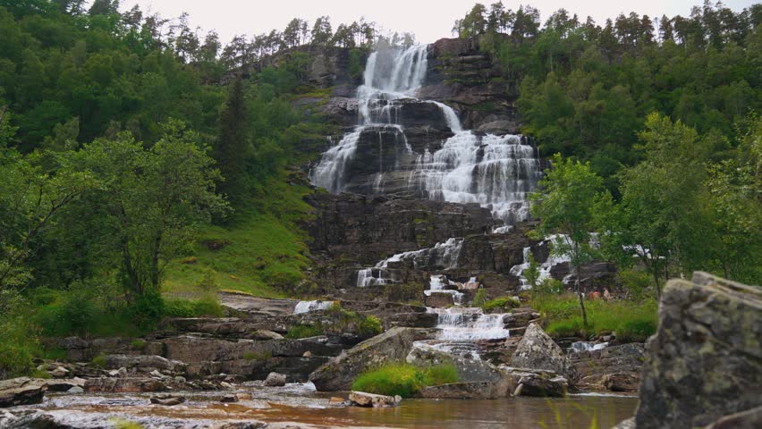 Tvindefossen waterfall in Norway. Scenic cascade in Scandinavia. Landscape river nature. Calming natural phenomenon.