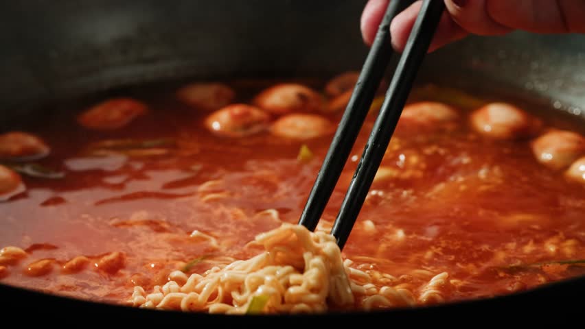 Japanese chinese hot pot noodles soup, Ramen with Beef or chicken, rice noodles with fried meat and mushrooms, Tom Yam kung Spicy Thai asian soup, chef cooking in traditional korean food. 