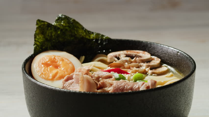 Japanese Ramen with Beef or chicken, rice noodles with fried meat, Tom Yam kung Spicy Thai asian soup, chef cooking in traditional korean chinese food. Close up of tasty korean cuisine. 