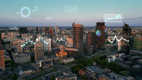 Aerial view of cityscape with overlay of stock market graphs and financial data. Modern city and statistical data concept. Business network, technology, statistics and analytics. 4k footage - Powered by Shutterstock - Get 15% off with code: PIKWIZARD15