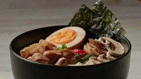 Japanese Ramen with Beef or chicken, rice noodles with fried meat, Tom Yam kung Spicy Thai asian soup, chef cooking in traditional korean chinese food. Close up of tasty korean cuisine.  - Powered by Shutterstock - Get 15% off with code: PIKWIZARD15