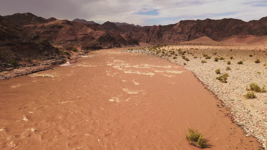 Aerial Shot Over the Orange River in Full Flow in the Desert