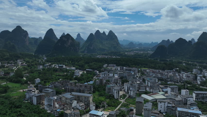 Hyperlapse drone shot tracking in front suburbs of Yangshou, summer in China