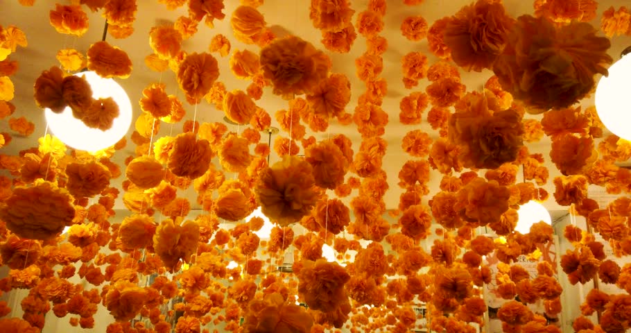 Detail of Día de Muertos decoration with Cempasúchil flowers hanging inside a venue in the heart of Mexico City