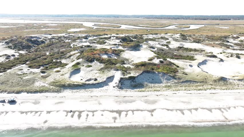 High angle aerial view of Cape Cod Sand Dunes near Sandy Neck Beach Park at Barnstable Massachusetts, USA on a sunny day.