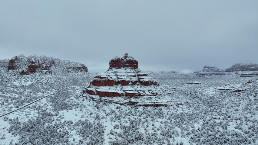 Bell Rock On Snow-Covered Wilderness In Sedona, Arizona, USA. Aerial Shot