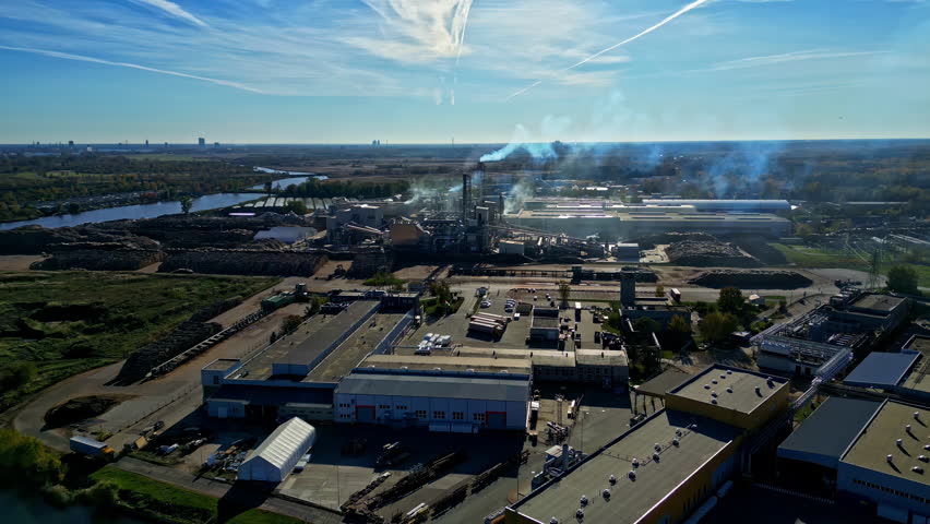 Pollution industrial factory, smoke smog coming out bad air quality, aerial