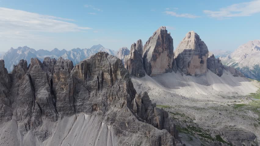 Panoramic drone footage showing Tre Cime di Lavaredo and surrounding peaks - 4K.
