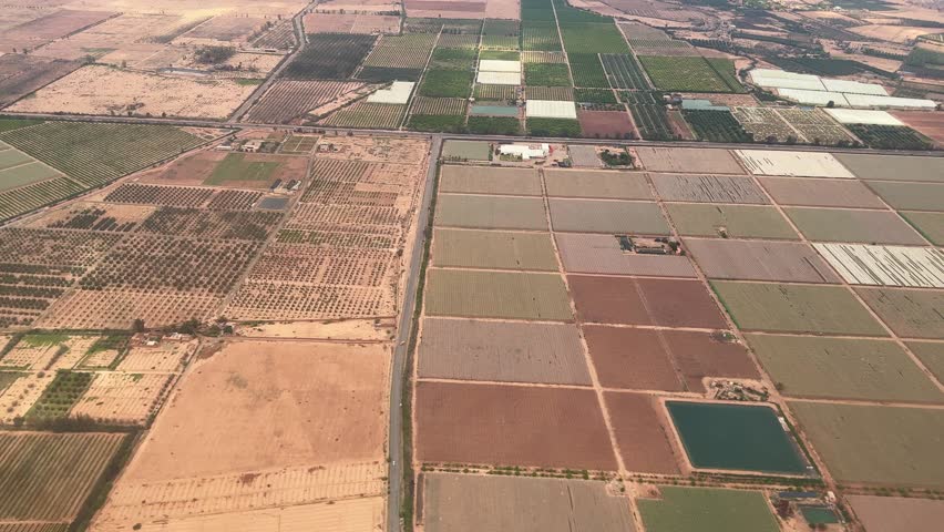 Aerial over Morocco farmland agriculture land farm field, drone video landscape