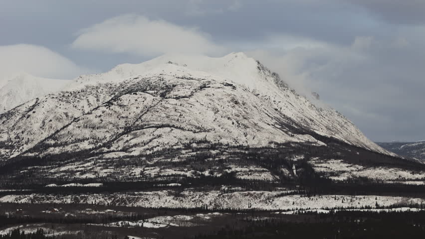 A Breathtaking View of Caribou Mountain, Blanketed in Snow During the Winter, Near the Town of Carcross in the Yukon, Canada - Aerial Drone Shot