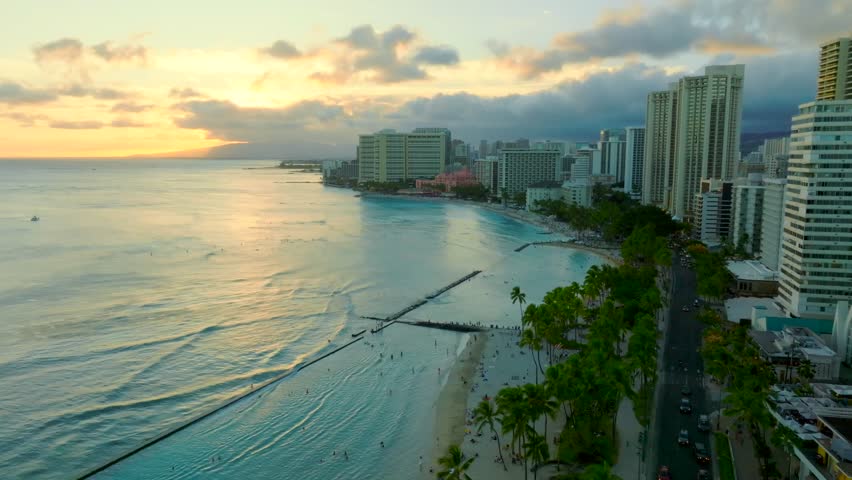 Drone flying over Waikiki beach during sunset at Honolulu Oahu Hawaii