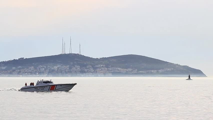 ISTANBUL - APR 2: Coast guard boat SAHIL GUVENLIK navigated around burning