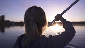 oar paddles on calm water against the background of sunset rays, outdoor activities on a kayak, - Powered by Shutterstock - Get 15% off with code: PIKWIZARD15