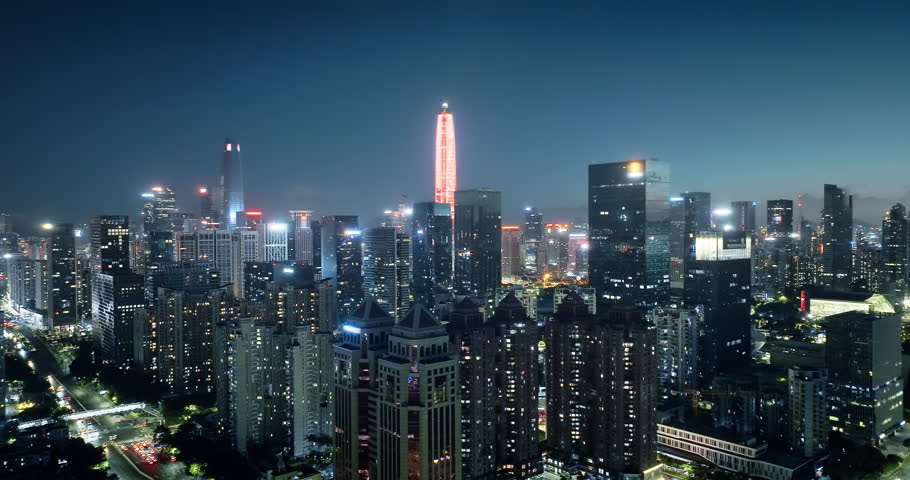 Night view of modern city financial district buildings and roads in Shenzhen, China