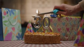 Number 30 Birthday Candles Lighting on Cake with Gifts - Powered by Shutterstock - Get 15% off with code: PIKWIZARD15