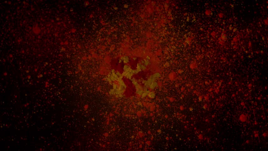 Super Slow Motion Shot of Rotating Color Powder Explosion on Black Background at 1000fps.