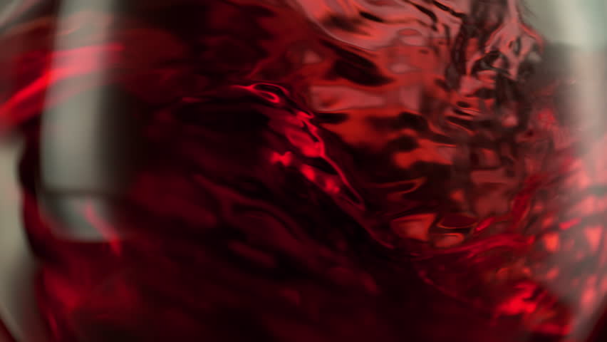 Super Slow Motion Macro Shot of Spinning Red Wine in Glass at 1000fps.